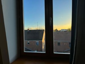 an open window with a view of a building at LAETITIA ET CLAUDE in Lille