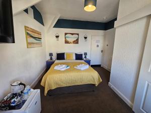 Łóżko lub łóżka w pokoju w obiekcie The Tilstone Guest House