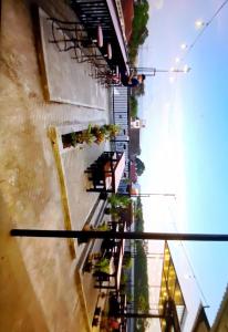 a view from the top of a building with reflections in the water at Ador 46 Homestay Syariah & Kost in Mergan +16 photos