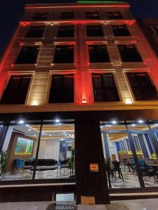 a building with a lot of windows and tables at White Palace Haliç in Istanbul