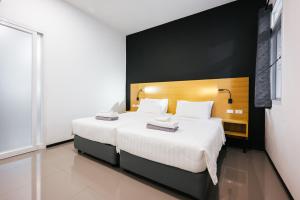 Katil atau katil-katil dalam bilik di Vivace Hotel
