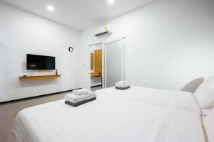 Tempat tidur dalam kamar di Vivace Hotel