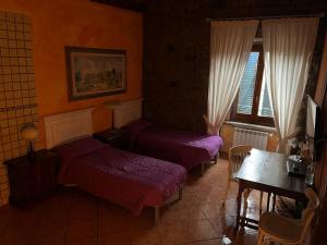 Postel nebo postele na pokoji v ubytování Albergo Diffuso Locanda Specchio Di Diana