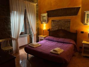 Postel nebo postele na pokoji v ubytování Albergo Diffuso Locanda Specchio Di Diana