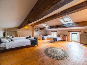 a large bedroom with a bed and a living room at LE GRAND FRANC gite cosy proche tous commerces in Tonnay-Charente