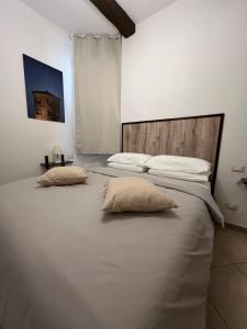 Кровать или кровати в номере Pascoli 21/A