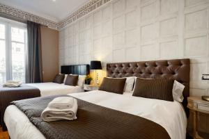 Postel nebo postele na pokoji v ubytování HoHomes - Luxury Palacete