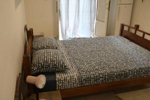 Tempat tidur dalam kamar di Pension Cargo