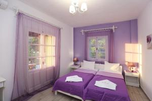 A bed or beds in a room at Evaggelia Studios