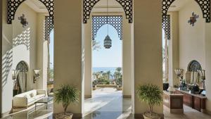 a lobby with an open door with a view of the ocean at Royal Arabian Stylish Chalets in Four Seasons Resort - By Royal Vacations in Sharm El Sheikh