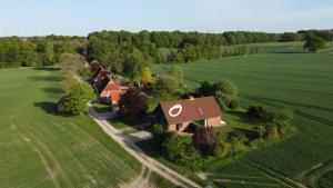 an aerial view of a house in a field at Landhaus mit Weitblick in Holtsee