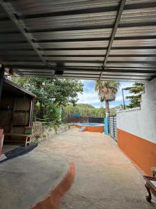 an empty garage with a large metal roof at Finca el Lomo in Las Palmas de Gran Canaria