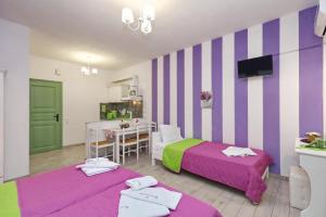 A bed or beds in a room at Evaggelia Studios