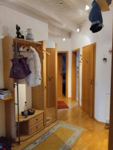 a room with a closet with a dresser at Maison Christa in Bad Kissingen