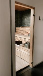 a view of a kitchen through a door at Lit de Clémot in Merelbeke