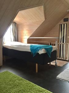 a bedroom with a bunk bed in a attic at Mitt i vackraste Bohuslän in Lysekil