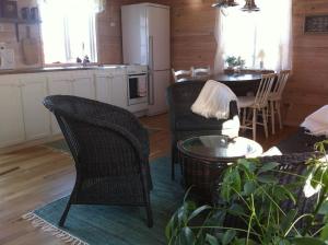 a kitchen and living room with chairs and a table at Mitt i vackraste Bohuslän in Lysekil