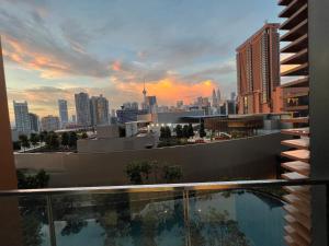 a view of a city skyline from a building with a pool at Lucentia Residence At Kuala Lumpur By Dreamcloud in Kuala Lumpur