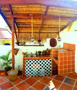 a kitchen with a stove and a counter top at The Suite Spot Apartment - Private Paradise Stay in Soufrière