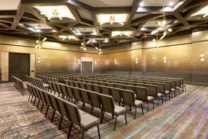 an empty lecture hall with chairs and a stage at Renaissance New York Harlem Hotel in New York