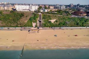 an aerial view of a beach with a clock tower at Bournemouth Highcliff Marriott Hotel in Bournemouth