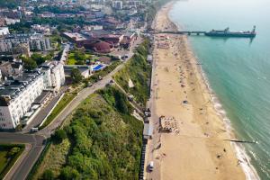an aerial view of a beach and the ocean at Bournemouth Highcliff Marriott Hotel in Bournemouth