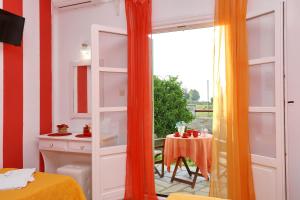 A bed or beds in a room at Evaggelia Studios