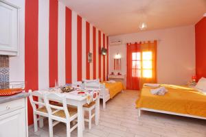 A bed or beds in a room at Evaggelia Studios