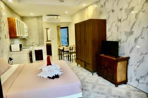 Η κουζίνα ή μικρή κουζίνα στο The Club Inn - Kamala Beach