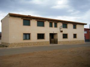 a building with windows on the side of it at Las Candelas de Torreandaluz in Torreandaluz