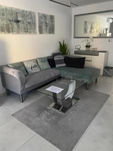a living room with a couch and a table at Apartmán Nitra in Nitra