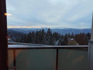 a balcony with a view of the mountains at Chamrousse - Résidence Le Vernon in Chamrousse