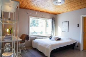 Postel nebo postele na pokoji v ubytování Arctic Garden Design Villa