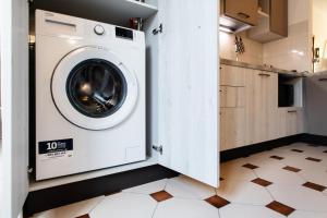 a washer and dryer in a kitchen at [Centro-Storico] Tutto a 2 passi in Rapallo
