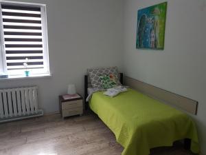 Łóżko lub łóżka w pokoju w obiekcie Apartament Angelo
