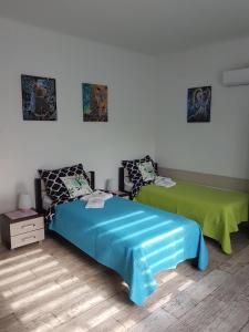 Łóżko lub łóżka w pokoju w obiekcie Apartament Angelo
