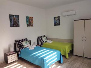 Łóżko lub łóżka w pokoju w obiekcie Apartament Angelo