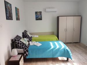 Łóżko lub łóżka w pokoju w obiekcie Apartament Angelo