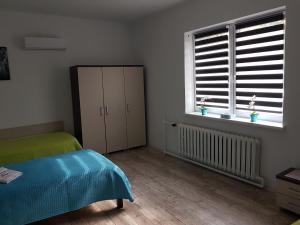 Łóżko lub łóżka w pokoju w obiekcie Apartament Angelo