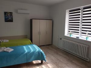 Łóżko lub łóżka w pokoju w obiekcie Apartament Angelo