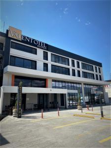 a large building with a sign on the front of it at VALENT OTEL BUSINESS in Balıkesir