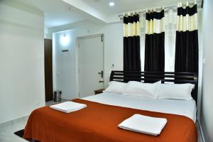 Postel nebo postele na pokoji v ubytování SHREE BALAJI PALACE Homestay