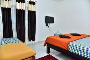Postel nebo postele na pokoji v ubytování SHREE BALAJI PALACE Homestay
