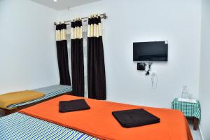 Postel nebo postele na pokoji v ubytování SHREE BALAJI PALACE Homestay