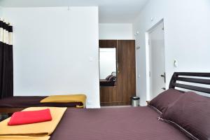 Postel nebo postele na pokoji v ubytování SHREE BALAJI PALACE Homestay