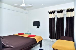 Postel nebo postele na pokoji v ubytování SHREE BALAJI PALACE Homestay