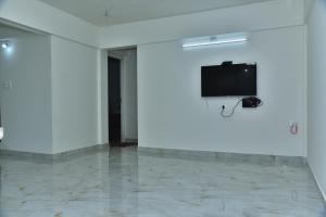 TV a/nebo společenská místnost v ubytování SHREE BALAJI PALACE Homestay