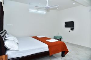 Postel nebo postele na pokoji v ubytování SHREE BALAJI PALACE Homestay