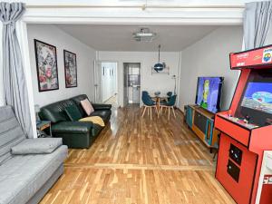 a living room with a couch and a video game at Martin´s Place in Alicante