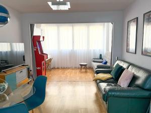 a living room with a couch and a tv at Martin´s Place in Alicante +5 photos